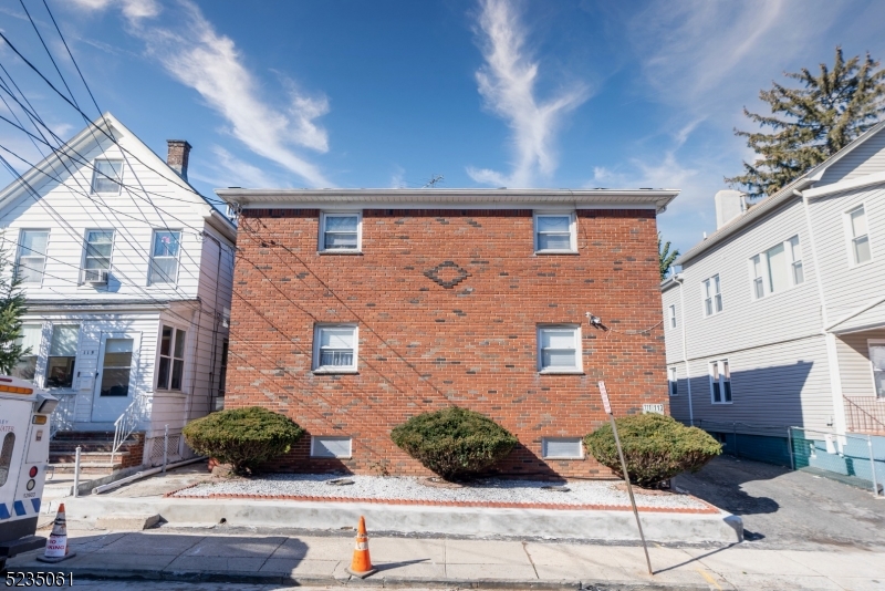 Amazing investment opportunity! in the heart of Elizabeth! Legal, brick 4 family with a total of 8 bedrooms and 5 full baths. All units with hardwood floors throughout, spacious living rooms, eat in kitchens, and full bath. Two separate basements, one partially finished with recreation room and full bath. Parking spaces for 3 cars. All separated utilities. Ideal location, only a few blocks from train, downtown Elizabeth and major highways. Tenants are month to month. This is an investor's dream! Come and tour it today!