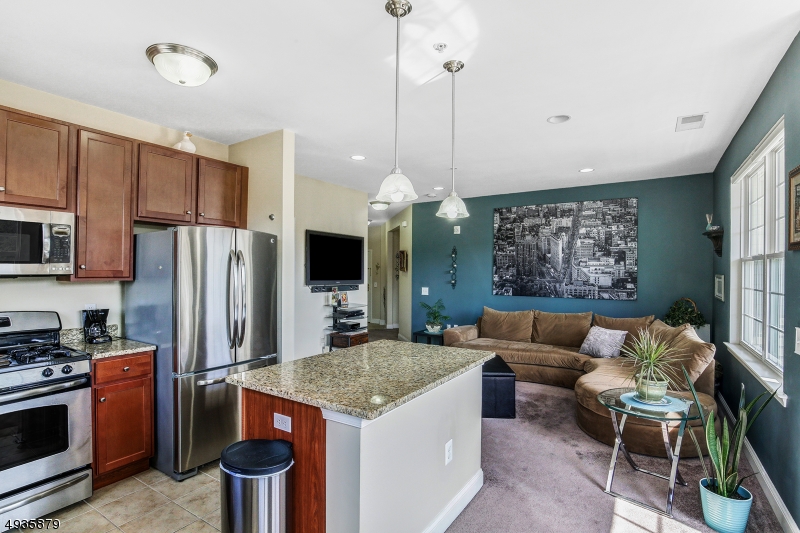 Great 2BR, 2BA Corner Inkberry unit at The Grande. Open floor plan & lots of natural sunlight makes you feel at home! Closest building to the pool, gym, tennis/basketball court and all the clubhouse amenities! LR/DR opens to beautiful Kit w/ center island, granite counters, soft-close cabinets, stainless appliances & new microwave. Other updates include new plush carpet throughout unit, new bathroom light fixtures, Nest Thermostat, high quality roller shades on all windows and soundproofed laundry area w/ newer upgraded washer & dryer. Original owners - Pet & smoke free!  Convenient to tons of shopping, restaurants & major highways.  Come see how grand life can be at The Grande!  Pets - 2 max per unit, 35lb max per pet.