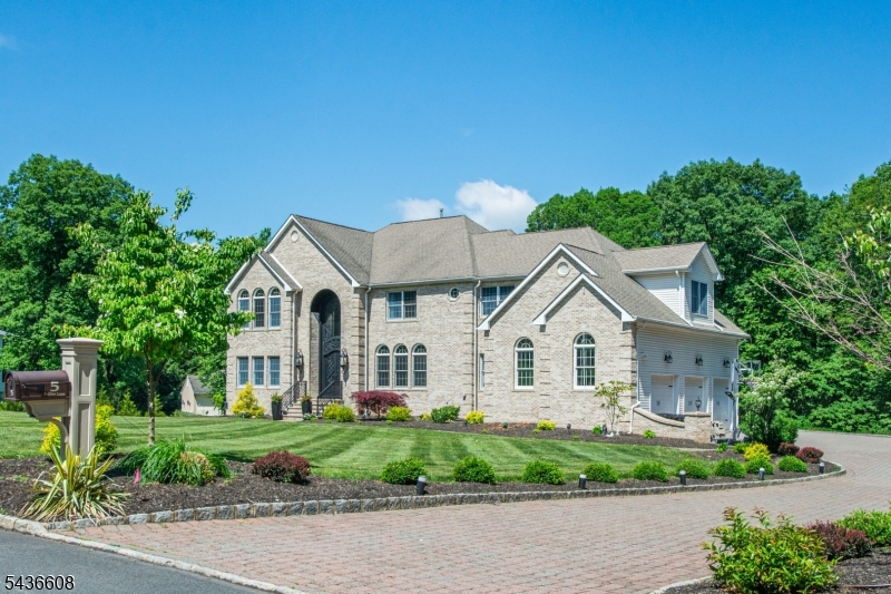 Spectacular Colonial, where sophisticated design, impeccable updates, & luxurious finishes create an unparalleled living experience!  A dramatic two-story foyer makes a breathtaking first impression, highlighted by an impressive crystal chandelier & a custom floor-to-ceiling entry door that sets the tone for elegance throughout the home.  Rich hardwood flooring flows throughout both the first and second levels.  At the heart of the home is a chef's kitchen featuring stunning quartz countertops, center island, & breakfast bar, top-of-the-line appliances, & stylish cabinets.  The kitchen is open to the breakfast room and family room; ideal for everyday living or entertaining on a grand scale! Family room features a soaring cathedral ceiling, arched windows with remote control blinds, and a gas fireplace w/marble surround. The main level also offers formal dining room & living room, office, secondary office/potential guest suite, and powder room!  The upper level includes the primary suite with luxurious ensuite full bathroom, secondary BR w/beautifully-updated full bathroom, & two additional BRs with a Jack-and-Jill bathroom.  Sitting room/exercise room & office adjacent to the primary bedroom. The thoughtfully finished walkout lower level features an updated kitchen, living room, bedroom, sauna, and media room. Smart home;electric car charger;designer light fixtures. This magnificent home has been extensively updated with attention to every detail!  4BR septic