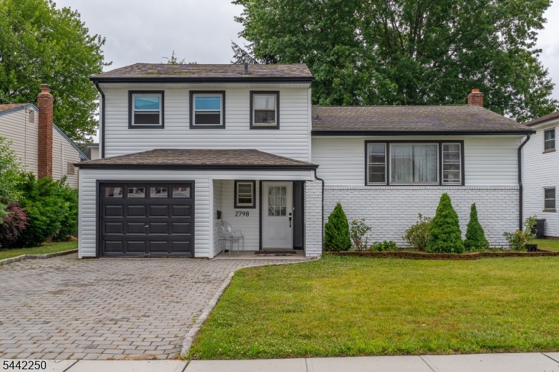 This move-in ready split-level is nestled in Union's desirable Larchmont neighborhood. Freshly updated with brand new siding, this home offers a versatile layout across four levels designed for the way you actually live. As you enter the main level, a spacious family room greets you alongside a convenient half bathroom. Make your way upstairs to the second level, where the living room opens with gleaming hardwood floors, and an inviting accent wall that adds a touch of character. The living room flows seamlessly into the dining room, where an elegant chandelier sets the tone for gatherings of any size. Just beyond, the updated kitchen features two-tone cabinetry, and a sun-filled eat-in area ready for your morning coffee. The third level is dedicated to three comfortable bedrooms and a full bathroom, providing a quiet retreat at the end of the day. Downstairs, the finished basement expands your living space with a den, a private office, a full bathroom, and a laundry room. Outside the expansive wood deck overlooks a lush, fenced backyard ready for summer barbecues and outdoor entertaining. This home delivers comfort, space, and convenience all in one.