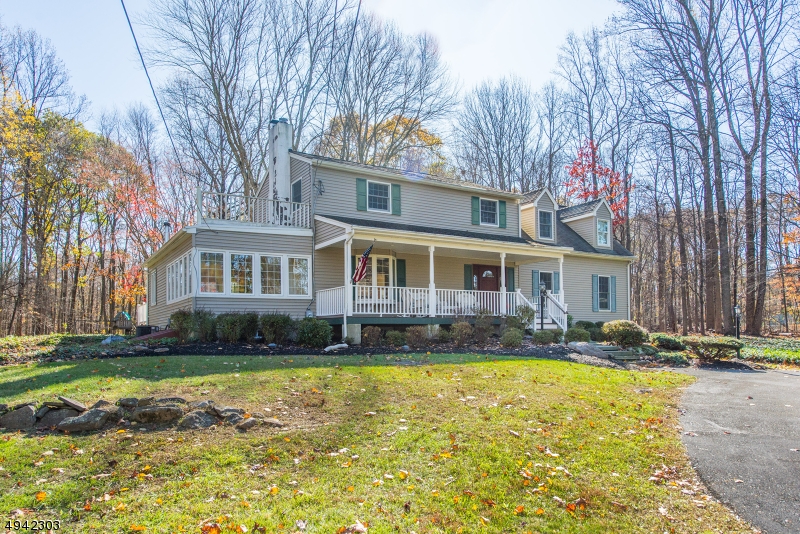 Serenity, Privacy & Value! Updated Custom Colonial on 2 acres. Wooded, level lot located on dead-end bordering park land. Long list of top features including super sized kitchen w/ granite, oak wood. Center Island, Pantry, Wood Burning Stove all add to an amazing kitchen, the heart of this home. Nestled between the 3 wall windowed dining room & family room w/ custom built-ins. Gorgeous views can be enjoyed from every room. Cozy living room with another fireplace & spacious master suite. Lots of room to spread out in this home with it's sprawling layout. And, that's just the inside. Lemonade front porch, back deck & fireplace give you additional outdoor space to be thankful for your surroundings. 2 car oversized garage & huge shed. Extremely well maintained, many updates. Minutes from Rt. 80 & Mass Transit.