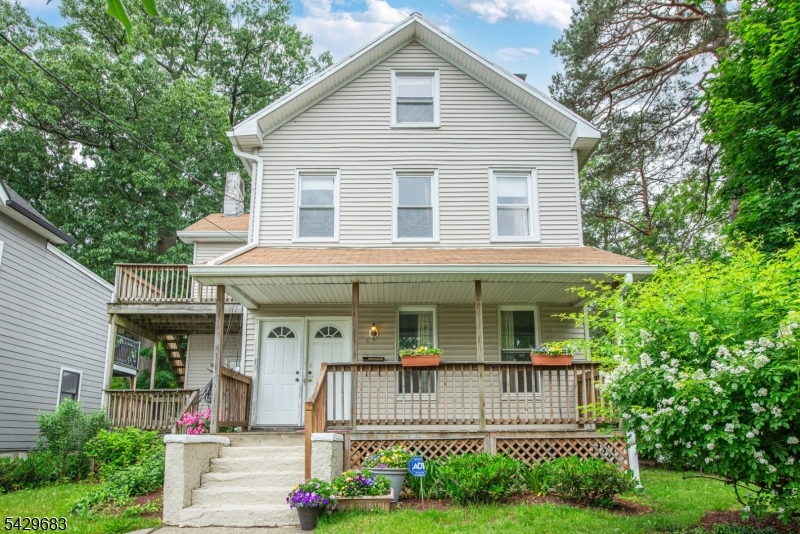 Montclair 2-family w parking for 4 cars, a spacious yard, lovely garden & CAC currently being used as a single-family, located in the Walnut Street District, recognized for its unique, village-like atmosphere & status as a premier dining/shopping destination. Boasting great curb appeal w 2 front porches & 2nd-story deck, this home is 0.2 mile from Walnut Train Station to NYC,  town pool & Walnut Street's Saturday Farmer's Market. Unit 1 comprises 1st floor w 1 bedroom, a living rm w FP, a full bath, an EIK w doors to front porch & backyard w parking for 4 cars. Unit includes full, finished walk-out basement w half bath, rec rm, utilities, storage & laundry for both units, w hook-up for 2nd washer/drier, & separate entrance for Unit 2 tenants. Unit 2, reached from a separate 1st floor entrance, comprises 2nd & 3rd floors & features 2 bedrooms, an EIK, full bath, an office & a 3rd floor w storage, a walk-in closet, & skylight, that could be a 4th bedroom.  Large lot has extra room for outdoor fun & gardening & possible expansion of existing structure.  Storage shed & blacktop parking for 4 cars, a real benefit as many properties lack off-street parking in this area. Currently used as a 1-family, this home, has separate utilities & 2-zone CAC, & can be restored to 2-family by closing the space between entrances to Units 1 & 2. Near schools, parks, NYC transport, shops/restaurants & more. Great opportunity to own a flexible property in one of Montclair's premier neighborhoods!