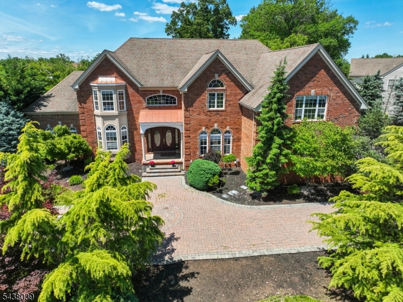 Pristine & Expansive Colonial Residence in the heart of NJ., Open floor plan with bright throughout. A welcoming living and dining rooms, a sun-drenched sunroom, and a well-appointed center-island kitchen,skylights & light-filled breakfast area.The inviting great room, centered around a gas fireplace. A versatile first-floor bedroom or private office flexibility to accommodate today's lifestyle needs.Upstairs, the luxurious primary suite offers a serene sitting area, two walk-in Closets, and a spa-inspired en-suite bath complete with soaking tub and shower. Generously sized bedrooms  all enhanced by custom California Closet  for exceptional organization and storage.The fully finished lower level  two bedrooms, a full bathroom, laundry area, and a spacious recreation room ideal for guests, extended living, or entertainment.Set on beautifully landscaped grounds, the outdoor living experience is equally impressive, featuring a patio, gazebo, designated grilling area, and a recently refreshed pond perfect for both relaxation and entertaining. Three-car garage, circular driveway, central vacuum system, and EV charger.Convenient access to major commuter routes, corporate centers, and the Manhattan-direct NJ Transit NEC train. Close to top-rated schools, shopping, dining, and recreational amenities, including Six Mile Run at the D&R Canal State Park. Just a short drive to Rutgers University, Princeton University, and the renowned medical centers of New Brunswick and Princeton.