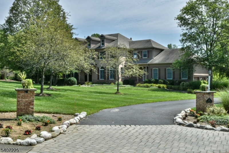 Located in one of Bernard's Township's most prestigious neighborhoods with a Far Hills address, this stunning colonial home has been owned by one owner since construction. Newly refinished hardwood floors, coffered ceilings, and detailed moldings throughout. Upon entry into the foyer, you will be awed by the grand central staircase with balcony overlooking the great room with gas fireplace. To the right of the foyer is the dining room with butler's pantry connecting it to the thoughtfully laid out kitchen with walk-in pantry, stainless steel appliances, and Sub-Zero refrigerator. The center island allows for ease in entertaining. There is an office with built-ins. The living room has the second gas fireplace. Sliding glass doors to the deck, patio, new barbeque area, and gunite pool allowing more entertaining options. Upstairs in the primary bedroom, the full bathroom has double sinks, jetted tub, and separate shower. There are 4 guest bedrooms, two offer attached full baths. The laundry/mud room is conveniently located near the 3 car garage. Also on this level are two powder rooms. The finished basement features a media room, exercise room, desk, and temperature controlled wine cellar. Recent updates include all new bathroom fixtures. New pool pump, cover, filter, and salt system. All new sprinkler valves. Enjoy all that Far Hills has to offer: equestrian facilities, top-rated schools, nationally ranked golf course, welcoming parks, easy access to NJ transit, and highways.