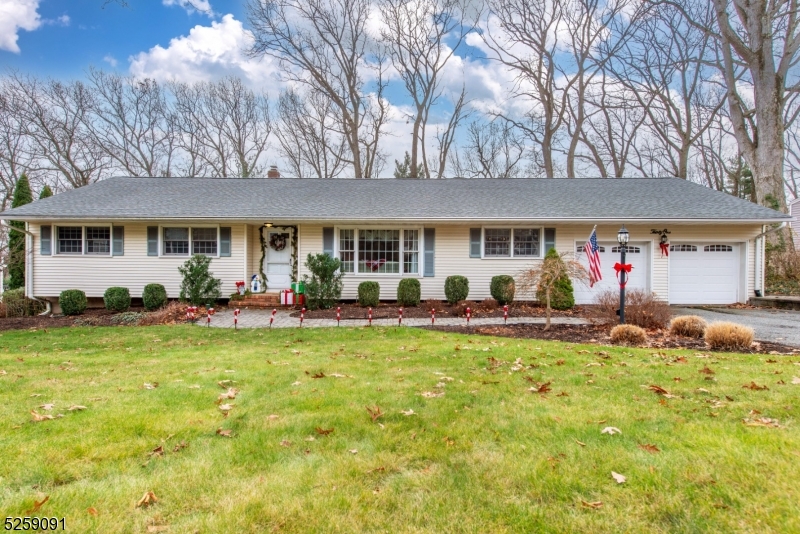 Beautifully updated Ranch in desirable Shongum neighborhood! Featuring NEW White Kitchen (2021) open to Family Room with brick wood burning fireplace, and slider to deck overlooking fenced-in backyard. Three spacious bedrooms and 2 newly updated baths. Large Living room & Dining room with architectural moldings. Hardwood floors throughout. Partially finished basement for extra living space. Mud room/Laundry room off kitchen with access to the backyard and the garage. Newer high-quality Anderson wood windows & new 16" of R30 attic insulation keep utility costs low. Sprinkler system. The plug-in natural gas generator stays with the house. Public utilities. Close to Morristown and all the major roads for commuting. One floor living at it's best! Don't miss this amazing home!