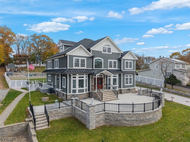 One-of-a-kind luxury construction on a dead-end street. Every detail of this high-end home has been thoughtfully designed & upgraded. A grand entry welcomes you to the entry foyer leading to a formal living rm, formal dining rm w/ fireplace & a gorgeous chef's kitchen w/ high-end appliances, custom cabinetry & dining area. The first floor is completed by a family rm w/ fireplace, an office, guest bedroom & 1.5 baths. Upstairs, a beautiful loft area opens to the primary suite-an indulgent retreat featuring a private balcony, 2 walk-in closets & a spa-like bathrm w/ soaking tub & separate shower. Four additional bedrooms, a laundry rm w/ double washer/dryer sets & a full hallway bath complete the second flr. The finished attic provides additional flex space for crafts, gym or studio. The fully finished basement is an entertainer's dream-complete w/ summer kitchen, exquisite bar, rec rm, full bath & second laundry area. Outside, enjoy resort-style living w/ an in-ground pool/hot tub, separate pool lounge/clubhouse w/ bar area, patio paver driveway/walkways, two-car garage w/ full bath & finished loft-perfect for studio space & professionally designed outdoor lighting for the ultimate ambience. Smart home technology, offering Wi-Fi control of security cameras, door locks, doorbell, surround sound & heating/cooling system. A sprinkler system & meticulously landscaped grounds complete this truly exceptional home. A rare opportunity to own a show-stopping masterpiece!