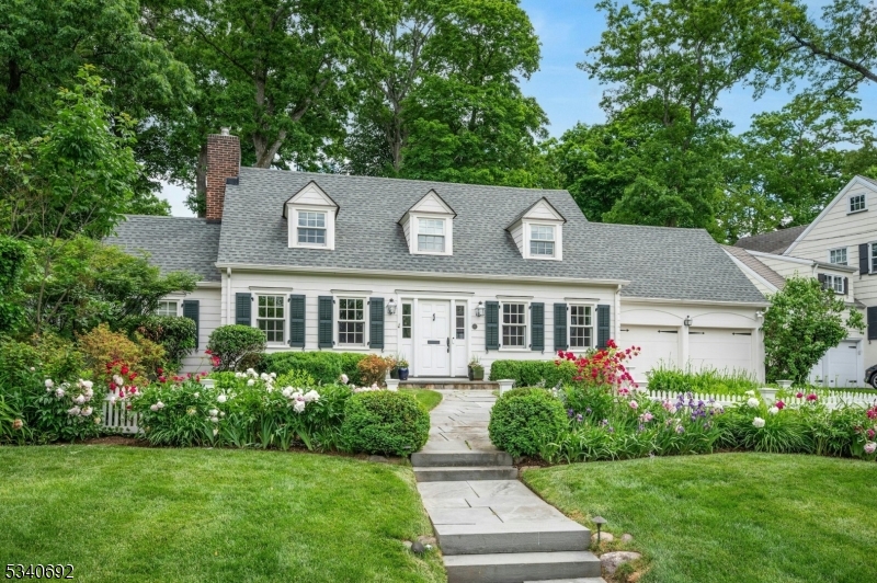 Updated, move-in ready home in coveted location close to town, train, Lincoln Hubbard Elementary School crowned #1 in NJ by US News & World Report , and convenient to Summit Middle School, Summit High School, and Kent Place School.  Comfort and convenience come together in a modern, thoughtfully designed floor plan. The formal Living Room with wood burning fireplace connects to the sun-filled Family Room adjacent to the designer Kitchen boasting a large eat-in area, center island and butler's pantry leading to the inviting Dining Room.  An office and powder room complete this floor.  The second level has 4 Bedrooms and 3 full Baths.  The lower level  Recreation/Exercise Room and Laundry Room complete the picture.  Enjoy a level, fenced-in yard with mature landscaping and privacy.