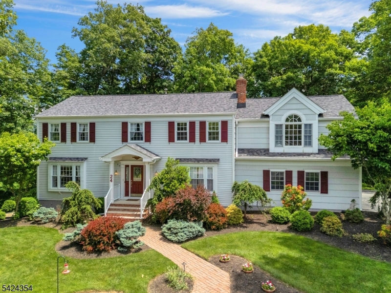 Nestled in one of Warren's most sought-after neighborhoods, known for its spacious properties and strong sense of community, this expanded Colonial is a retreat. Beautiful curb appeal welcomes guests with a brick paver walkway and inviting exterior. The heart of the home is a stunning rear addition that created a sun-drenched, open-concept layout. High vaulted ceilings and oversized windows frame views of the private backyard, while the spacious kitchen complete with a center island and breakfast bar flows effortlessly into the family room.  The three-season room features beautiful wood floors and provides a peaceful space to enjoy the surrounding landscape while remaining comfortably indoors. Upstairs, the primary suite is a true "wow" moment, with vaulted ceilings, two walk-in closets, a private bath, and a large sitting room that is ideal for a home office or flex space. The finished walkout basement adds valuable living space and includes access to a temperature-controlled office/storage room with shelving, offering endless possibilities for remote work or additional storage. Set on over an acre of property, you'll enjoy a private backyard surrounded by mature landscaping & nature. Major updates provide peace of mind, including a two-year-old roof, a whole-house generator, and newer windows throughout the home. Come see why life in Warren is so special.