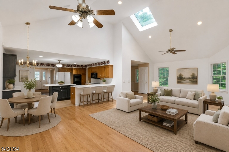 Nestled in one of Warren's most sought-after neighborhoods, known for its spacious properties and strong sense of community, this expanded Colonial is a retreat. Beautiful curb appeal welcomes guests with a brick paver walkway and inviting exterior. The heart of the home is a stunning rear addition that created a sun-drenched, open-concept layout. High vaulted ceilings and oversized windows frame views of the private backyard, while the spacious kitchen, complete with a center island and breakfast bar, flows effortlessly into the family room.  The three-season room features beautiful wood floors and provides a peaceful space to enjoy the surrounding landscape while remaining comfortably indoors. Upstairs, the primary suite is a true "wow" moment, with vaulted ceilings, two walk-in closets, a private bath, and a large sitting room that is ideal for a home office or flex space. The finished walkout basement adds valuable living space and includes access to a temperature-controlled office/storage room with shelving, offering endless possibilities for remote work or additional storage. Set on over an acre of property, you'll enjoy a private backyard surrounded by mature landscaping & nature. Major updates provide peace of mind, including Roof (approximately 2.5 years old), Air Conditioning (2021), Hot Water Heater (2020), Furnaces (2018 & 2014), & Whole House Generator (2013). Square footage is taken from the floor plan.