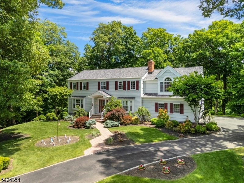 Nestled in one of Warren's most sought-after neighborhoods, known for its spacious properties and strong sense of community, this expanded Colonial is a retreat. Beautiful curb appeal welcomes guests with a brick paver walkway and inviting exterior. The heart of the home is a stunning rear addition that created a sun-drenched, open-concept layout. High vaulted ceilings and oversized windows frame views of the private backyard, while the spacious kitchen, complete with a center island and breakfast bar, flows effortlessly into the family room.  The three-season room features beautiful wood floors and provides a peaceful space to enjoy the surrounding landscape while remaining comfortably indoors. Upstairs, the primary suite is a true "wow" moment, with vaulted ceilings, two walk-in closets, a private bath, and a large sitting room that is ideal for a home office or flex space. The finished walkout basement adds valuable living space and includes access to a temperature-controlled office/storage room with shelving, offering endless possibilities for remote work or additional storage. Set on over an acre of property, you'll enjoy a private backyard surrounded by mature landscaping & nature. Major updates provide peace of mind, including Roof (approximately 2.5 years old), Air Conditioning (2021), Hot Water Heater (2020), Furnaces (2018 & 2014), & Whole House Generator (2013). Sq. ft from the floor plan updated after the addition. Does not include the basement.