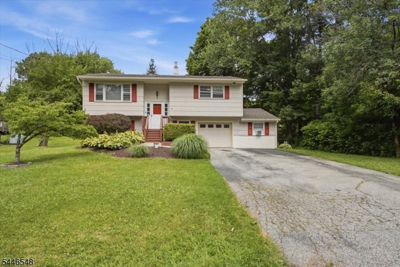 Enjoy the perfect balance of everyday comfort and year round recreation in this nearly 1,800 sq ft bilevel located in the Barry Lakes community of Vernon. This 3 bedroom, 1 full & 1 half bath home features an open and bright main living area with refinished hardwood floors, an updated kitchen with dining area, and direct access to the refinished deck overlooking the backyard. Recent improvements include a NEW roof and boiler system, along with ductless mini splits for added comfort. The lower level offers a spacious family room, third bedroom, half bath, and access to the attached garage. Connected to the garage is additional finished bonus space currently used as a recreation and exercise room, offering endless possibilities for hobbies, a game room, workshop, home office, or fitness area. Outside, enjoy the deck, fire pit, and backyard with plenty of space to entertain, garden, or relax. Barry Lakes residents enjoy access to a private lake with swimming, fishing, kayaking, a clubhouse, and playground. Conveniently located near Mountain Creek, Crystal Springs Resort, Wawayanda State Park, and downtown Warwick, NY, this home offers easy access to outdoor adventure, golf, dining, shopping, and more.