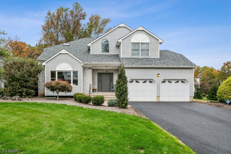 Tucked away on a quiet and idyllic cul-de-sac in one of North Edison's most desirable and sought-after neighborhoods, this beautifully maintained Colonial offers the perfect blend of elegance, comfort, and functionality. Situated on a beautifully landscaped lot, the home welcomes you through elegant field stone entrance way into a dramatic two-story foyer and light-filled living and dining spaces designed for both everyday living and entertaining. The gourmet eat-in kitchen flows seamlessly into the inviting family room with a stone fireplace and opens to an expansive deck, creating effortless indoor-outdoor living. The luxurious primary suite provides a private retreat with a spa-inspired bathroom.The full finished basement, complete with a custom glass-block wet bar, offers exceptional space for entertaining, recreation, or relaxation. Outside, the private wooded backyard provides a peaceful setting for gatherings or quiet enjoyment. Conveniently located near schools, shopping, dining, and transportation, this exceptional home offers an unparalleled lifestyle in one of North Edison's premier locations.