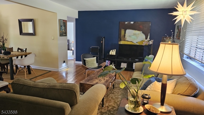 Welcome to this beautifully maintained 2-bedroom, 1-bathroom condo that perfectly blends comfort, style, and convenience. Filled with natural light from the windows, this bright and inviting home offers a warm and relaxing atmosphere, making it the perfect place to unwind and feel at home. Thoughtfully designed for comfortable everyday living, the home features a cozy and welcoming layout ideal for both quiet evenings and entertaining guests.The spacious primary bedroom features two large closets, providing plenty of space for organizing clothing and accessories. The kitchen includes a charming breakfast nook by the window, perfect for enjoying your morning coffee and the refreshing breeze.Elegant flooring flows throughout the home, adding warmth and sophistication to every room. Enjoy the peaceful surroundings of the meticulously landscaped grounds, creating a serene setting right outside your door.