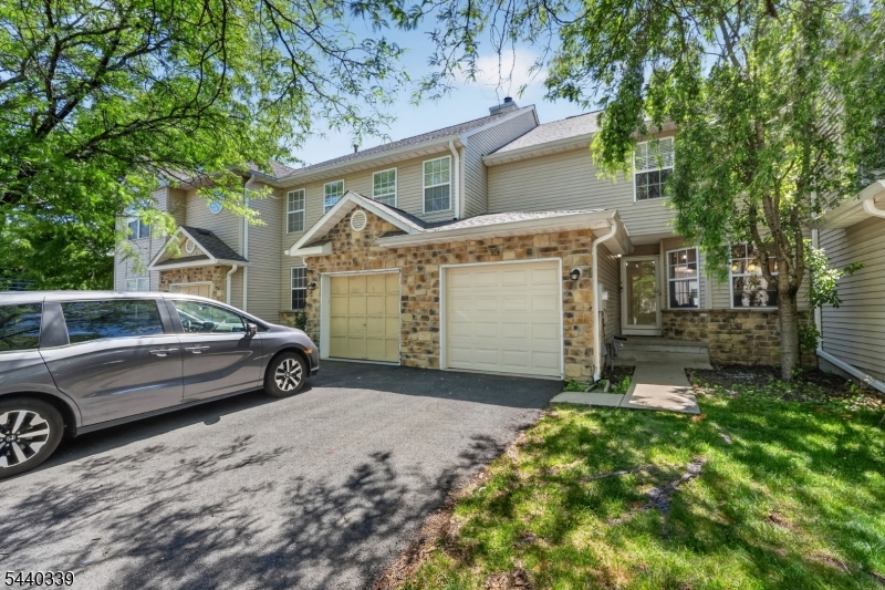 Welcome home to this beautifully renovated NORTHEAST-facing townhome in the desirable RidgeView community of South Brunswick. This move-in-ready residence combines modern comfort with refined style. A freshly painted interior and elegant hardwood flooring create a warm first impression upon entry. The inviting living room, highlighted by a cozy fireplace, flows seamlessly into the formal dining area with sliding doors leading to a private paver patio. The thoughtfully updated eat-in kitchen serves as the centerpiece of the home, featuring granite countertops, stainless steel appliances, ceramic tile flooring, a designer backsplash, and a charming breakfast nook for casual dining.    Upstairs, the impressive primary suite offers soaring ceilings, a customized closet system, and a tastefully remodeled spa-inspired bath complete with dual vanities and a luxurious soaking tub. A generously sized second bedroom, full bath, and conveniently located laundry area complete the upper level. The fully finished basement provides versatile additional living space, perfect for a media room, home office, gym, or recreation area. Distinctive upgrades throughout the home includes EV Charger, new garage door with wifi system, crown molding, recessed lighting, upgraded water heater, new dishwasher and a newer HVAC system. Ideally situated near highly rated schools, shopping, dining, major highways, this exceptional home offers the perfect blend of comfort, sophistication, and convenience!