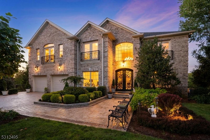 Rare opportunity for a fully furnished, impeccably crafted, 6500+ SF luxury home situated on a quiet cul-de-sac in the Reserve at Bel Air.Even before entering, the meticulous hardscape and landscape design highlight the pride of ownership and attention to detail in this custom brick colonial home.Step through the elegant iron and glass doors into a grand two-story foyer filled with natural light. From here you'll access the office, living room, and powder room.Proceed to the open-concept kitchen/family room where quartersawn oak extends throughout the space. The Viking appliances and granite island makes entertaining or daily meals a pleasure, while the dining room is perfect for formal events.Gather around the oversized wood burning fireplace or step through the French doors for stunning views of the valley below.Upstairs offers 4 spacious bedrooms, including a large primary suite with sitting room, custom closet and spa-like bath with jetted shower and tub, ideal for relaxing after a long day.The lower walkout level features radiant floors, 2nd kitchen/wine cellar, family/recreation room, exercise room, full bath + storage rooms. French doors lead to a covered veranda, perfect for serene moments or lively get-togethers.Additional convenience features include 1st and 2nd floor laundry facilities + a heated garage with finished floor, built-in cabinets, sink and granite countertop. Too much to list!Close to top schools, shops, dining, NYC and Rts 280, 78, 10, 24, and GSP.