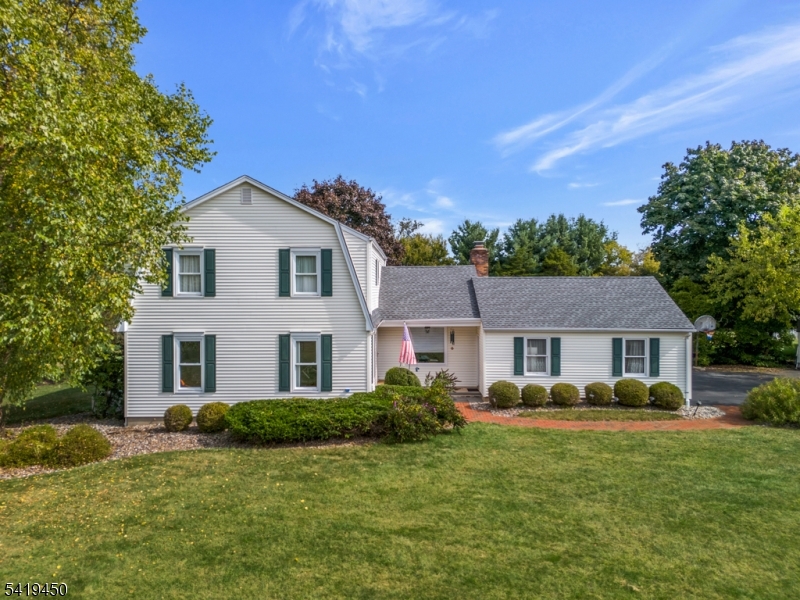 Impeccably maintained and thoughtfully updated, this Colonial offers seamless flow, classic design, and exceptional indoor outdoor living in a highly sought after neighborhood. This turn-key home features sun filled living spaces with hardwood flooring, a designer inspired palette, and thoughtful updates throughout. The layout is functional, ideal for everyday living and entertaining. At the center of the home is the family room is highlighted by a stone faced wood burning fireplace and sliding glass doors that open to an expansive deck overlooking a sparkling in-ground pool and patio. This outdoor space creates a true extension of the home, perfect for entertaining, relaxing and designed for unforgettable summer gatherings.The formal living room flows into the dining room, offering defined yet connected spaces, while the eat-in kitchen features a breakfast nook with deck access. A powder room, laundry and pantry complete the first floor. Upstairs, the primary suite is generously sized and has a walk-in closet and beautifully appointed ensuite bath with spa-like shower featuring multiple shower heads and body jets. Three additional bedrooms with custom closets and a stylish yet functional renovated main bathroom complete this level. Additional highlights include a dry basement with high ceilings, two car garage, and commuter friendly location with easy access to NYC train service, major hwys, shopping, and dining. The perfect balance of comfort, function, and lifestyle.