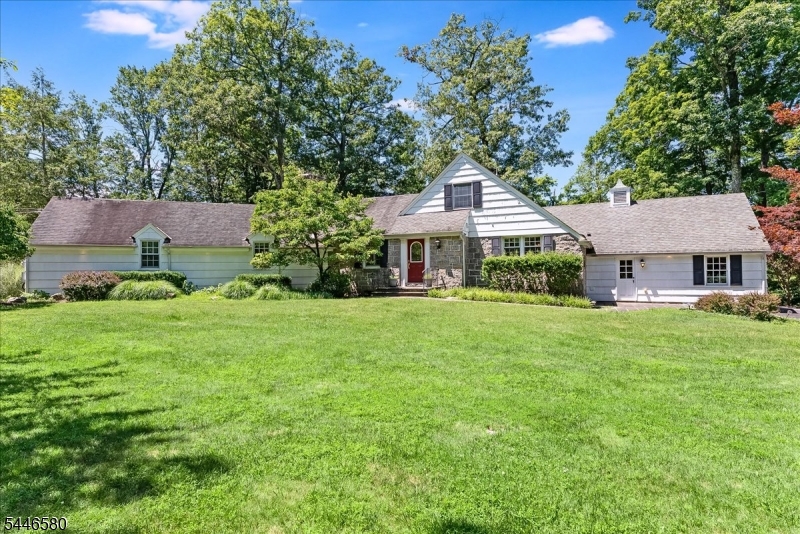 Experience this Amazing Sprawling EXPANDED RANCH WITH IN-LAW SUITE situated on a picturesque Corner Lot featuring 2 Ponds & Year-Round Lakeviews directly across the street from Lake Kinnelon in highly sought-after Smoke Rise Community just 35 minutes from NYC! The First Floor features a spacious Family Room with Wood-Burning Fireplace, exquisite Octagon-shaped Great Room highlighted by wooden Ceiling Beams & beautiful Brazilian Cherry Hardwood Floors, Eat-in Kitchen with Center Island, Formal Dining Room, and 2 spacious En-Suite Bedrooms including a Primary Suite with Walk-In Closet. The Second Level displays 2 additional Bedrooms with ample closet space. The Full Finished Basement offers a BONUS In-Law Suite space with separate entrance, a Bedroom, Full Bathroom, & Laundry Room. Enjoy a Park-Like property setting directly across the street from Lake Kinnelon, a Boat Ramp & Dock, and just a 5 minute walk to Smoke Rises private Beach. Savor the Country-Club lifestyle offered in Smoke Rise with amenities such as; Boating, Sailing, Swimming, Tennis, Basketball Court, Baseball Field, Hiking trails, Horseback riding, Sports Bar, dining in the Smoke Rise Village Inn & 24/7 Gated Security.