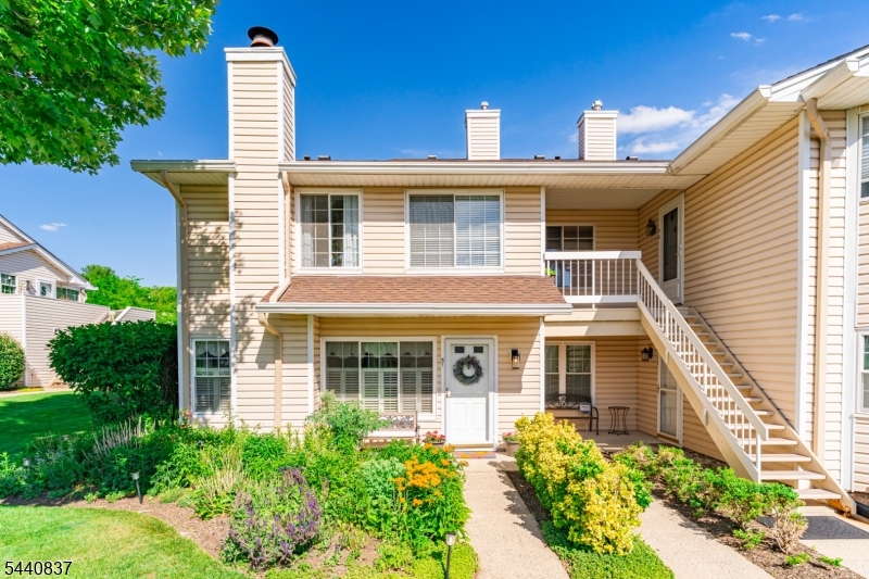 Bright, sun-filled, and ideally situated, this beautifully updated, end-unit townhome offers the perfect blend of comfort, style, and low-maintenance living. This move-in-ready home features three bedrooms, two full bathrooms, one powder room, two private decks, and a cozy wood-burning fireplace with a classic mantel ideal for both everyday living and entertaining.Thoughtful upgrades are showcased throughout, including newer flooring, fresh designer paint, plantation shutters, and custom sliding glass doors on upper and lower levels. The updated kitchen features stainless steel appliances and seamlessly opens to the living and dining areas. Recessed lighting with dimmers in the living room and newly renovated kitchen. Recent improvements provide exceptional peace of mind, including  beautifully renovated primary and secondary bathrooms with a marble shower and vanity (2025), a newer water heater, as well as newer HVAC system. An attached garage with direct interior access adds both convenience and security. Perfectly located just minutes from Routes 202/206, 78, 287, and 22, and within walking distance to shopping, dining, everyday conveniences. Amenities include access to a clubhouse fitness center, two community pools, three tennis courts and four pickleball courts. This exceptional home offers easy living in a highly desirable location with the added benefit of low Bedminster taxes.