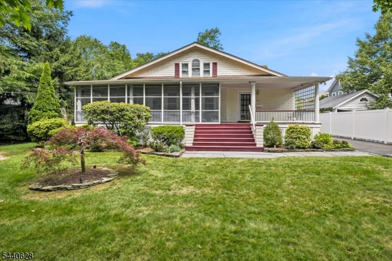 Gracious 17 room Colonial on a perfect, level half-acre of manicured grounds in one of Westfield's loveliest tree lined neighborhoods.  This spacious Arts & Crafts Colonial has three expansive levels of living space.  The main level boasts an impressive formal living room with a fireplace and elegant pre-war Chestnut woodworking, a formal dining room with gorgeous sconces, breakfast room, eat-in-kitchen, primary living suite with sliders to a private deck and full bath plus two guest bedrooms.  The lower level is fully finished with a walkout to the back patio, a Recreation Room with a full kitchen with refrigerator, electric oven, dishwasher and garbage disposal, 3 offices, a Spa-like full bath with a Jacuzzi tub and an over-sized walk in shower, workshop and a laundry room with a washer and two dryers.  The lower level has a complete French drain and a computerized generator.  The upper level boasts 2 bedrooms, another full bath and a den.  The exterior has a deck, reinforced paver patio, screened in front porch, 7 zone sprinkler system with Rain Sensor cut-off, fully illuminated front and rear yard and a new roof...plus so much more.