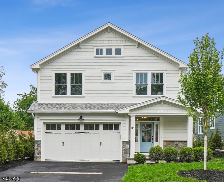 Welcome to 86 Ashwood Ave. The last available home in a newly developed subdivision.  A 100% BRAND NEW Craftsman Colonial that checks all the boxes. Great exterior architectural style with a rocking chair front porch. 2-car attached garage with EV charging port. The walk-out basement has 9' high ceilings & designed with full size windows & patio doors. The interior design is exciting and features a modern kitchen with Thermador professional series appliances, quartz tops, a wine bar and a full pantry closet. High ceilings and tall windows bring in abundant natural light. Wide plank white oak floors. Large second floor laundry room. Multi-zone HVAC. Security system. Full attic storage with plywood floors. Multi-zone lawn irrigation system and much more. Please note: 86 Ashwood is NOT a renovation. Instead, it conveys all the benefits of a newly built home with the assurance of a new home warranty plan. Developed by award-winning Menza & Beissel, with a 34 year track record.