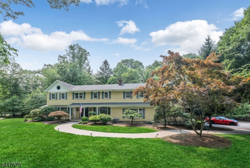 Experience the quintessential Franklin Lakes lifestyle in this stunning colonial retreat, where sophisticated design meets everyday comfort. From the moment you pull into the expansive driveway leading to the three-car garage, it's clear this property is something special. Inside, the home unfolds with an effortless flow, offering five spacious bedrooms and four beautifully appointed bathrooms that provide plenty of room for everyone to find their own corner of calm. The heart of the home is designed for those who love to host, with sun-drenched living spaces that transition seamlessly to the outdoors. Step outside into your private oasis, anchored by a sparkling pool that promises endless summer afternoons of relaxation and refined entertaining. Whether you're hosting a grand garden party or enjoying a quiet morning coffee on the patio, the grounds offer a sense of privacy and elegance that is hard to find. Beyond the property lines, this home offers a rare and coveted lifestyle perk: an exclusive membership to Shadow Lakes. This isn't just a house; it's an invitation to join a community known for its scenic beauty and premier amenities. With its perfect blend of luxury finishes and a warm, inviting atmosphere, this is the Franklin Lakes sanctuary you've been waiting for.