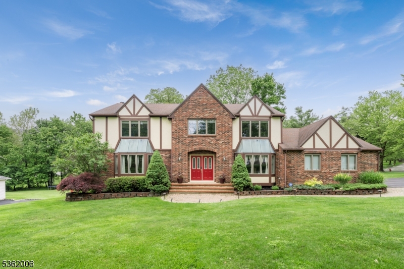 UPDATED & SPACIOUS TUDOR CENTER-HALL COLONIAL IN PRIME RANDOLPH NEIGHBORHOOD CLOSE TO Y, CCM, RTE 10! With fresh paint & attention to detail, 5 Mariner Drive presents an entertainer's dream with 5 Bedrooms, large unfinished Lower Level with great potential & over .5-acre lot with incredible deck & above-ground pool! Hardwood floors, windows everywhere, enhanced millwork, wood-burning fireplace, oversized rooms, closets & spa-like bathrooms make modern suburban living a pleasure. First Level boasts Living & Dining Rooms with matching bay windows drawing in tons of natural light & views of the landscaped yard & quiet street. Spacious Eat-in Kitchen features center island, stainless steel appliances, granite countertops, stone backsplash, plenty of cabinet storage & sliding doors to glorious two-tiered wood deck with dining space plus spots to relax around the pool. Step into the Family Room from the deck or Kitchen to enjoy movie night or a cozy fire. First Floor Laundry, Home Office/5th Bedroom & Powder Room complete this level. Up a gorgeous hardwood staircase with iron balusters, the Second Level offers more room to relax with 4 great-sized Bedrooms including Primary Ensuite with massive walk-in closet & bathroom with two sinks, modern soaking tub, walk-in shower & high-end design elements. Neighborhood offers social events & the YMCA is only blocks away. Randolph is known for excellent schools, beautiful parks & strong community. Make it your home today!