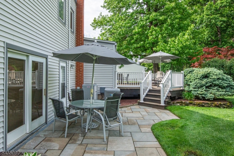 Meticulously maintained and beautifully updated, this 4 bedroom, 2.1 bath split level showcases true pride of ownership and is the definition of a "cream puff  home. Fantastic curb appeal is enhanced by professional landscaping and inviting outdoor spaces including an expansive deck and patio perfect for entertaining or relaxing. The bright and spacious living room features a vaulted ceiling, skylights and gas fireplace, flowing seamlessly into the formal dining room. The updated kitchen is designed for both style and functionality with quartz countertops, double oven, gas range and built-in table area. The expanded primary suite offers a spacious walk-in closet and luxurious primary bath with oversized stall shower. Additional living space includes a comfortable family room with sliders to the patio and a finished basement ideal for recreation, office or gym. Hardwood flooring, thoughtful updates and meticulous maintenance throughout make this home truly move-in ready. A wonderful opportunity to own a home that has been lovingly cared for inside and out.