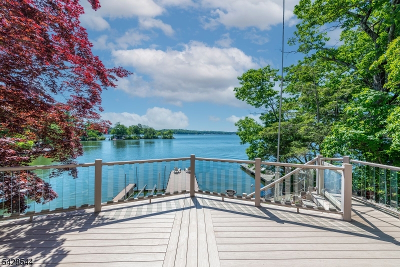 Welcome to your perfect lakefront retreat! This charming ranch is tucked away on a peaceful dead- end street and features 3 bedrooms, two full baths, and a stunning new kitchen with skylight. The Living room boasts high ceilings, a beautiful stone fireplace, and large windows that fill the space with natural light.! Spend your summers on the oversized deck or down by the brand-new dock. This home offers beautiful views of Lake Hopatcong and is conveniently located to shopping, restaurants, and major highways.