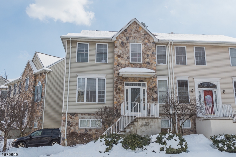 Bright, open, updated 3 bedroom, 2 1/2 bath townhouse with finished walkout basement and 2 car garage. This town home offers an open floor plan with tons of light coming in. The first floor has hardwood floors, high ceilings, a gas fireplace, well sized kitchen with lots of storage, a deck and powder room. The second floor offers a master bedroom suite with walk-in closet, full bath with double vanities, soaking tub and stall shower and double-door entry to bedroom. Two additional well sized bedrooms and an updated bathroom complete the second floor. The basement offers a finished family room with sliders to the back yard, laundry room and access to the 2 car garage.
