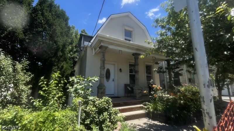 Fully renovated single-family home/an alternative to a condo, ready for its new owner. The main floor features a bright open-concept living and dining area, along with a modern kitchen offering a peninsula and quartz countertops. This home includes 2 bedrooms and 2 full bathrooms. The finished basement provides extra living space and includes a full bathroom, laundry room, and utility area. Updates include new electrical and plumbing systems, a water softener, split air-conditioning systems, radiant heat, a tankless water heater and more. Conveniently located near parks, schools, shopping, restaurants, major highways, and public transportation, making commuting to Newark and New York City easy.  This property can be sold together with the adjacent property (318-320 Cortlandt St) with the potential for a 12-unit development. Suitable for a savvy investor/developer.