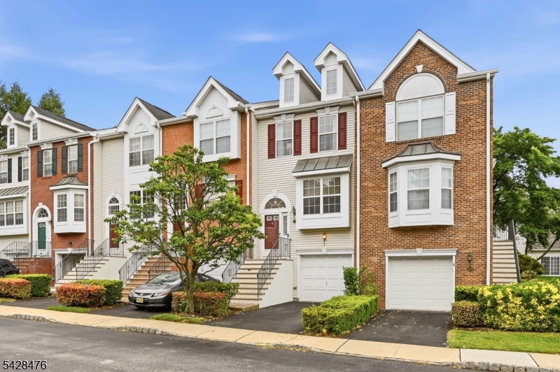 Nestled within the prestigious gated community of Cambridge Heights, this beautifully updated tri-level townhome offers the perfect blend of space, style, and convenience. Featuring 2 bedrooms and 2.5 baths, this residence is thoughtfully designed for modern living. Step inside to discover warm wood flooring flowing throughout the home, creating an inviting atmosphere. The sun-filled, updated, eat-in kitchen showcases gorgeous Quartz countertops, a custom backsplash, modern appliances, and generous counter space, ideal for morning coffee or entertaining guests. The adjoining living and dining areas provide a seamless layout, while a powder room and coat closet complete the main level. Upstairs, the private living quarters include two spacious bedrooms and two full bathrooms. The primary suite features an en-suite bath and ample closet space, while the second sunlit bedroom offers two closets and easy access to the second full bath. A conveniently located laundry area is also situated on this level. The lower level boasts a versatile walkout family room perfect for a media room, office, gym or all 3. The door leads to a peaceful patio retreat and the attached one-car garage adds convenience. This home also features a brand new TRANE HVAC system, water softener, Reverse Osmosis system & updated baths. Residents enjoy a pool, fitness center, tennis courts, playground, clubhouse, easy commuting options, restaurants, shopping, and more nearby.