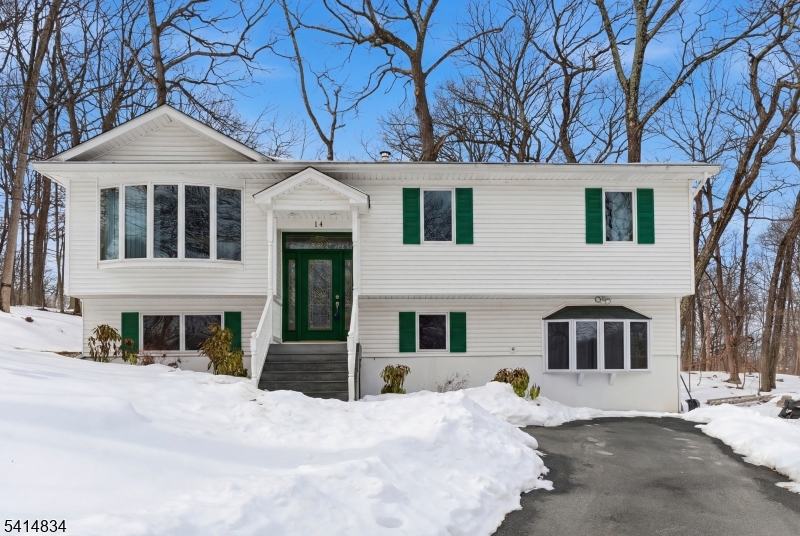 This well-designed 3 bedroom, 2 bath bilevel offers the perfect blend of comfort, character, and versatile living space. Beautiful hardwood floors and rich wood trim bring warmth and timeless appeal to the main level. The extravagant kitchen is a true standout, featuring granite countertops, an abundance of cabinet space, and plenty of room to prep, gather, and entertain with ease. The dining room opens directly to a deck, creating a seamless indoor-outdoor flow. The lower level expands your living space with a spacious family room finished with durable laminate flooring, plus a flexible den and an additional bonus room perfect for a home office, gym, or guest space. Spacious, inviting, and packed with desirable features, this home is ready to impress.