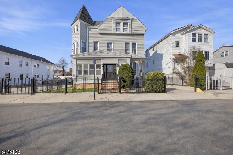 Rare investment opportunity in North Newark offering offering an attractive 7%+ cap rate with strong upside potential. Fully occupied property featuring a unique side-by-side layout with two spacious 3 story units, each offering 5 bedrooms, multiple bathrooms, and large living areas. Additional income potential with 4 detached garage/storage units, a large finished basement with separate entrance, and a central laundry room. Property includes separate heating systems for each unit and a private driveway leading to a 4-car garage. Conveniently located near NYC transportation, major highways, schools, shopping, and public transit. Ideal for investors seeking stable cash flow with value-add potential.
