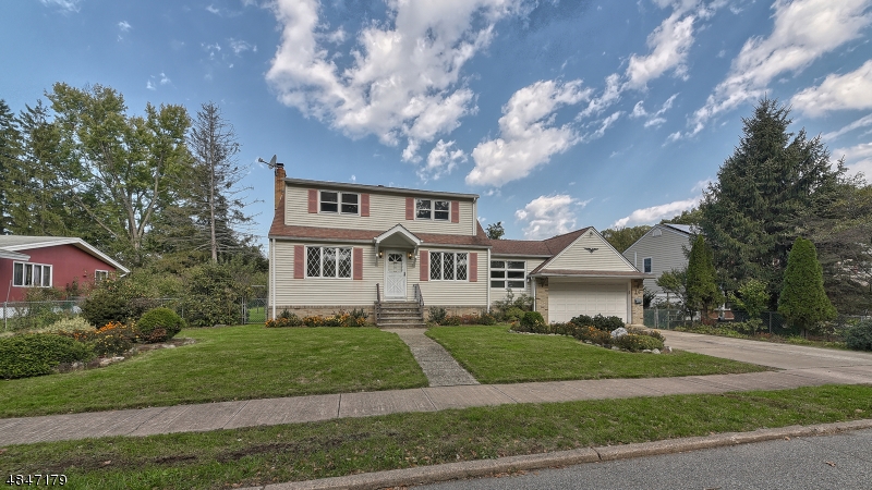 Opportunity Knocks! Desired Location- Packanack Manor expanded Cape offering 4 bedrms, 2 baths,partially finished basement & 2 car garage. Come see the space this home offers & the amazing property! The spacious main level enters into the Living Room, sizable EIK, Dining Room, 4Th bedroom and main bath. Also, an office, mudroom with access to garage and deck. The roomy second floor has an open Family Rm , 3 bedrooms and 2nd bath. The basement is partially finished and has a wood-burning stove, plenty of storage and laundry room. Home offers a flexible floor plan and awaits your personal touches. This beautiful home is nestled on park-like property with amazing fruit trees, a covered deck and patio for entertaining. Home is sold strictly "As Is". Located close to transit, top rated schools and highways.