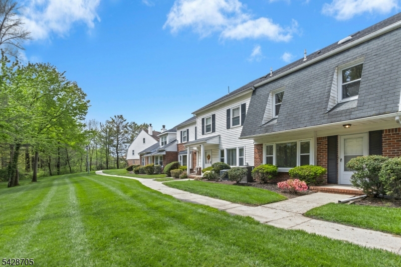 Just in time to enjoy so many of the amenities offered at the popular Southwyck townhome community. Tennis and pickle ball courts, the gleaming outdoor pool, relaxing gazebo, and the clubhouse!  This inviting and well designed townhome offers a combination of spacious rooms and serene parklike views from the LR and bdrm. The 1st floor with LR, formal size DR, EIK, and den w/fpl, and powder room is appealing for everyday comfortable living and for entertaining. The attached garage is accessible from the den. A master bdrm suite with full bath and walk in closet, a 2nd large bedroom w/hall bathroom, and laundry room complete the second floor. A dramatic loft overlooks the master suite. The loft adds so much versatility.  Make it your own whether as a home office, fitness area, tv room, library.  The possibilities for the loft are endless. A few short steps to the the pool and other amenities. 24 hour security gate for access to the community.  Conveniently located to shopping, supermarkets, NYC bus and major highways.