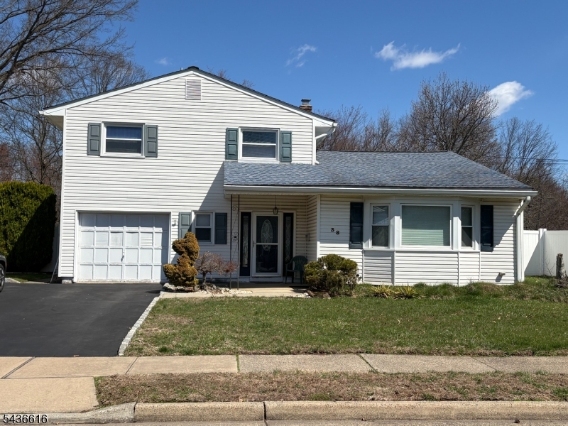 Location is perfect! This home is in the highly sought-after NORTH EDISON SCHOOL DISTRICT! This beautiful & spacious home is designed for both comfortable living & effortless entertainment. Upon entry is a foyer leading to a versatile layout featuring a family room with sliding doors to the backyard, a convenient half bath, & a first-floor bedroom. The heart of the home is the living room, complete with a gas fireplace & a soaring cathedral ceiling that fills the space with abundant natural light. Just a few steps up, the open dining room overlooks the living area, offering an elegant setting for everyday meals & special gatherings. Conveniently located off the dining room, the bright eat-in kitchen provides ample space for casual dining. The kitchen leads directly to a generous two-tier deck, seamlessly blending indoor & outdoor living. The third level features three bedrooms & a full bath. Step outside to your own private retreat from the kitchen onto the beautiful two-tier deck. The expansive backyard features an in-ground pool, a fire pit & backs directly onto a park providing added privacy & peaceful green views. Green Acres Park provides a playground, fenced in dog area, pickleball courts, basketball courts & picnic areas! With plenty of space for play, gardening, or simply relaxing, This outdoor oasis is perfect for making lasting memories. With its dramatic living space, flexible floor plan, & exceptional outdoor setting, this home combines comfort, style, & location.