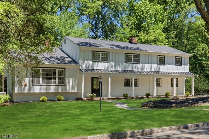 Exceptional opportunity in Springfield's sought-after Baltusrol neighborhood, just moments from the Summit border. This beautifully renovated 5-bedroom, 3.5-bath Colonial blends timeless charm with today's most desirable finishes. A thoughtfully designed open-concept floor plan offers exceptional flow for both everyday living and entertaining, highlighted by an expansive great room filled with natural light. The main level is enhanced by two fireplaces, adding warmth, character, and inviting gathering spaces throughout. The oversized dining room features striking exposed beams, creating a welcoming setting for entertaining. Extensive renovations provide peace of mind, including new hardwood floors throughout, new roof, new windows, new HVAC heating and cooling systems, new water heater, and numerous additional improvements. The spacious kitchen opens seamlessly to the main living areas, while generously sized bedrooms and beautifully updated baths provide comfort and functionality. Step outside to a brand-new patio overlooking the private backyard, perfect for relaxing or entertaining. Ideally situated near downtown Summit and less than two miles from the Summit NJ Transit station, residents enjoy convenient access to award-winning dining, boutique shopping, parks, and direct rail service to New York City. A rare opportunity to own a move-in ready home offering modern updates, exceptional living space, and an unbeatable location.