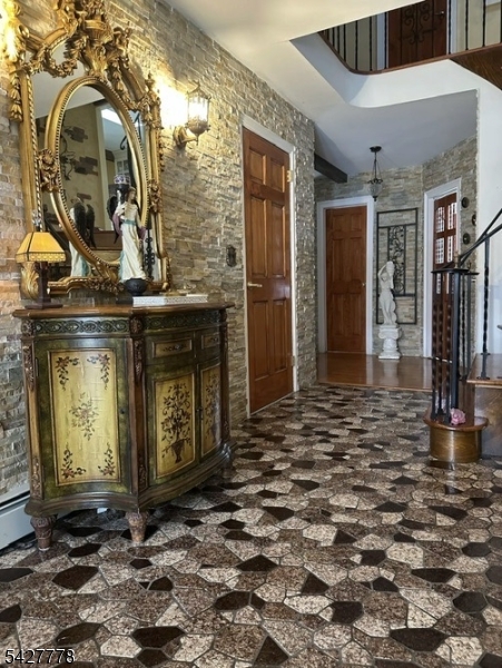 Welcome to this beautiful, custom and well maintained split-level single-family home in desirable Hanover. Proudly offered by only its second owner, this property has been thoughtfully cared for and upgraded over the years (2016-2019). This spacious home features 3 generously sized bedrooms and 2.5 bathrooms, along with an inviting living room. The updated kitchen offers modern finishes and functionality, flowing seamlessly into a formal dining room-perfect for everyday living and entertaining. On the ground level, you will find an expansive family room ideal for gatherings. Step outside from the dining room onto a lovely deck overlooking the backyard, complete with a patio designed for relaxing or hosting guests. Conveniently located in an excellent area close to transportation, shopping centers, and dining. Plenty of parking in addition to the 2 car-garage. New roof replaced on May 2026.  Seller holds a Real Estate License