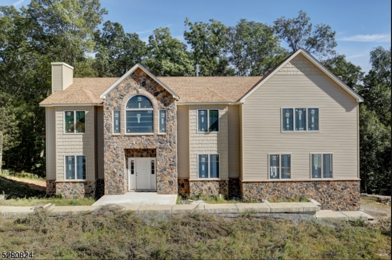 Brand new townhouse complex, Mountain Way in one of Parsippany's most sought out neighborhoods!  Second floor interior unit with outside deck and stairs to back yard lawn area.  Enjoy this open concept style of living with a Living Room, Dining Area, and Kitchen/Dining Area.  A foyer leads to a Coat Closet, Linen Closet and Washer and Dryer.  Bright and airy with neutral colors.  Hardwood floors and wall-to-wall carpeting in both bedrooms.  Enjoy one full bath and plenty of cabinet space in the Kitchen.  This ideal location, while nestled in the mountain landscape of Morris County is also a commuter's dream - close to various NJ transit buses and trains, and all major highways, including Route 287, Route 46 and Route 10 - you are only 30 miles away from NYC!  This unit is still under construction but will be ready by April 1! ADDITIONAL PICTURES BEING ADDED MONDAY, MARCH 18TH.  BEDROOM CARPETING BEING INSTALLED THIS WEEK.