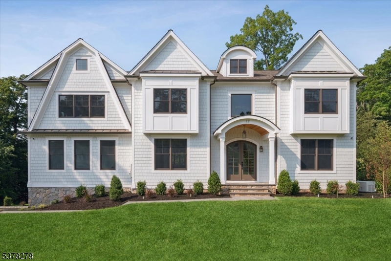 The scale, craftsmanship, and finishes of this home are unmatched at this price point?nothing else compares. A must-see opportunity for discerning buyers. Don't miss the opportunity to own one of the best values in town.17 Hilltop Terrace, where impeccable design meets modern luxury in one of Chatham Township's most coveted locations. This 7-bedroom, 7.5-bath masterpiece impresses at every turn, from the custom chef's kitchen with inset cabinetry, high-end appliances, and dramatic wine wall, to the white oak floors and soaring ceilings that create an airy elegance throughout. The show stopping primary suite features a designer chandelier, spa-inspired bath with a soaking tub, custom vanities, and an oversized shower. A scullery, spacious first-floor ensuite bedroom, two mudrooms, and a covered patio with fireplace elevate everyday living. The finished lower level is an entertainer's dream with a wellness room, recreation area with kitchenette, private guest suite and 3 car garage. Perfectly positioned near top-ranked schools, shopping, Midtown Direct trains, and major airports, this home delivers the ultimate in style, comfort, and convenience. 6032 square feet includes LL, 1st and 2nd floors of living space.
