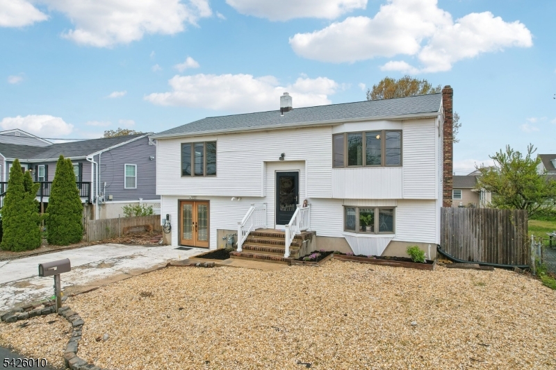 Welcome home to this beautifully maintained 3-bedroom, 2-bath bi-level in the heart of Toms River, where comfort, flexibility, and outdoor living come together. Thoughtfully designed with a versatile layout featuring two bedrooms upstairs and one downstairs, this home offers endless possibilities for guests, a home office, or additional privacy.The upper level features a spacious primary bedroom with a cedar closet, adding both charm and practical storage. Hardwood flooring awaits beneath the vinyl flooring, offering even more potential to personalize the space. The kitchen blends timeless character with updated appliances, creating a warm and inviting place to cook and gather.Step outside and picture yourself enjoying your own backyard retreat. Designed with entertaining in mind, the expansive deck, patio, and hot tub create the perfect setting for summer barbecues, relaxing evenings, or hosting gatherings year-round. The yard has recently been seeded, with fresh grass on the way to complete the outdoor space.Additional upgrades add even more value and convenience, including an EV charging outlet already installed and a newly repaved driveway. Located close to shopping, dining, beaches, parks, and everything Toms River has to offer, this is an opportunity you won't want to miss.