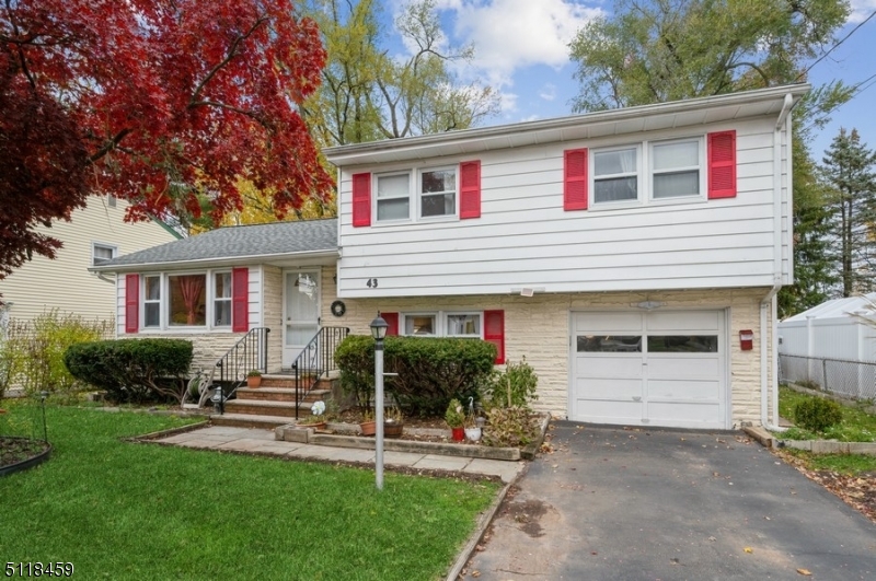 Move right into this well-maintained Split Level home with three bedrooms, two full bathrooms, and a deep back yard bordering a park. Convenient to shopping, dining, and schools, this home is less than a mile to the NJ Transit Direct train and offers a back yard view of the sprawling Simons Memorial Park. Highlights include gleaming hardwood floors throughout, central air conditioning, an eat-in kitchen, and a large back yard with a patio, storage shed, and garden. On the main level, a light and bright living room with a big picture window flows to the formal dining room and an eat-in kitchen. The kitchen features granite counters, tile backsplash, warm wood cabinets, stainless steel appliances, and ample room for a dinette set. The second floor offers three generous-sized bedrooms and a full bathroom. On the ground level is a comfortable family room with real wood paneling, another full bathroom, laundry room, entrance to the attached one-car garage, and access to the fenced-in back yard. The finished basement level includes a bonus room that could be used for an office or den, along with plenty of storage space. There is nothing to do but move right in and enjoy all the amenities this highly rated community has to offer!