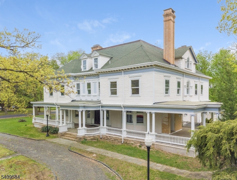 The iconic Coriell Mansion, built in 1880 and located in the Van Wyck Brooks Historic District, is recognized as one of Plainfield's largest Gilded Age estates. This rare offering combines a historic landmark property with a fully operational, income-producing short-term rental business.Situated on an approximately 32,000-square-foot lot, the approximately 11,000-square-foot mansion generates approximately $360,000. The sale includes both the real estate and the established short-term rental operation, providing a true turnkey investment.Architectural highlights include Colonial Revival design with Georgian influences, featuring a grand main staircase with Scamozzi Ionic capitals. The property blends historic elegance with modern functionality, offering multiple bedrooms, expansive common areas, and flexible layouts ideal for luxury stays and group accommodations.Backed by proven demand, repeat bookings, and established systems, this asset offers stabilized cash flow with upside potential. A rare opportunity to own a landmark estate delivering scale, income, and long-term value.