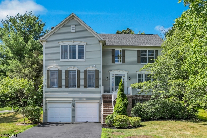 Quietly tucked away on a cul-de-sac in Lafayette Watch in The Hills in Basking RIdge, this Shelburne model pairs classic architecture with a spacious floor plan and enduring quality.  Sun-filled rooms and beautiful hardwood floors on both the first and second levels create a warm, welcoming atmosphere throughout. At the heart of the home, the expansive kitchen features a large center island, abundant cabinetry, and generous prep space, opening effortlessly to the family room anchored by a fireplace and custom floor to ceiling built in bookshelves. A private office with built-in workspace, formal living and dining rooms, and powder room complete the first level. Upstairs, you'll find an expansive primary suite with large walk-in closet space plus three additional bedrooms offering comfort and privacy for all. The finished lower level with a full bath adds valuable flexibility for recreation, work, fitness, or overnight guests. Other features of this well maintained home include excellent storage spaces and a six-zone underground sprinkler system. Defined by generous proportions, an exceptionally functional floor plan, and a coveted cul-de-sac location, this home offers enduring appeal. Enjoy nationally ranked Bernards Township schools, easy access to shopping, dining, parks, commuter routes, and The Hills' outstanding amenities, including a community pool, clubhouse, tennis and pickleball courts, and walking and jogging trails. Fireplace digitally lit.
