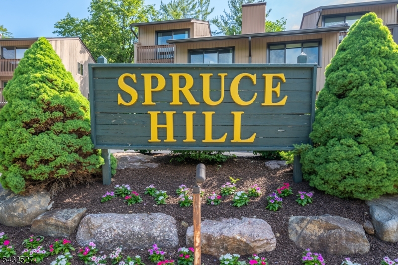 Beautiful end-unit townhome with stunning sunset views overlooking the Rockaway River! This spacious, light-filled home features an open floor plan designed for comfortable living and entertaining. The second floor offers two generously sized bedrooms, each with its own private ensuite bath with a third bedroom on the first-floor or possible home office with a nearby powder room for added convenience.  The main living area includes a spacious eat-in kitchen with pass-through to the large dining room. A bright living room highlighted by an elegant wood-burning fireplace. Two oversized sliding glass doors lead to a private deck perfect for outdoor dining, relaxing, and enjoying peaceful river views.  Additional features include two oversized garages, a large utility/storage room, and a recreation room offering plenty of extra living space. Tucked away in a secluded setting, yet conveniently located near major highways, NYC transit, shopping, restaurants, and everyday amenities. A rare opportunity to own a highly desirable riverfront end unit, don't miss it!
