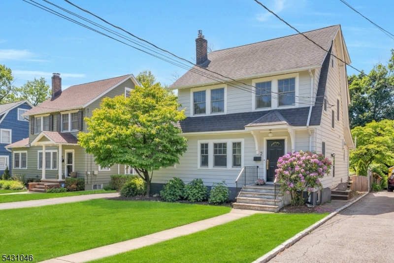 Location and modern sophistication Welcome to 2 Columbus Ave! Beautifully renovated and completely move-in ready, this Side Hall Colonial offers 4 bedrooms and 2.5 baths on one of Montclair's most sought-after side streets. Just minutes from Walnut Street shops, restaurants, breweries, bakeries, the farmers market, and Midtown Direct train.The inviting living room features a stunning gas fireplace with fluted marble surround and opens into a spacious family room perfect for gathering. The designer kitchen is a true standout with quartz countertops, center island seating, subway tile backsplash, quartz counters, open shelving, and premium appliances including a 6-burner Wolf range, Sub-Zero refrigerator, Miele dishwasher, and steam convection oven. A butler's pantry adds extra storage and a convenient coffee station. There's also a side porch/den that is a perfect sun-filled home office. An updated powder room completes the 1st floor. Upstairs offers 3 sun-filled bedrooms and an updated hall bath with soaking tub. The private third-floor primary suite feels like a retreat with custom built-ins, sitting area, and spa-like bath with radiant heated floors, dual vanities, and oversized wet room with soaking tub and walk-in shower. Finished lower level with family room, laundry, storage. Brand new hardwood floors, ductless AC, newer windows, 1 car garage, paver patio, fenced yard. Come enjoy the perfect blend of comfort, elegance, and modern living in the heart of Montclair.
