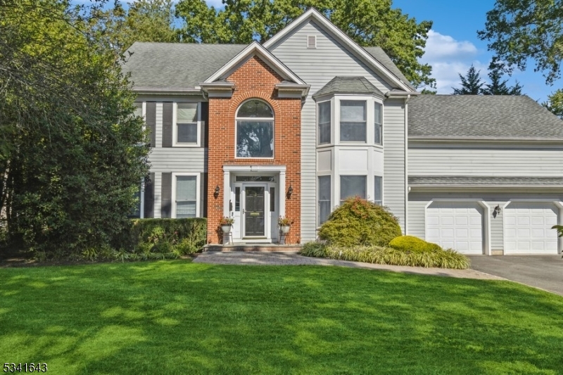 Nestled in the heart of Madison, this stunning 5 Br 41/2B home blends classic charm with modern updates. It offers an unparalleled lifestyle in a community known for its top-rated schools. These beautifully landscaped grounds have a saltwater pool, hot tub, and fenced yard is a perfect retreat blocks from town, train, and schools. Step inside to discover a two-story foyer, a charming living room with custom-built-ins, and a formal dining room. A chef's kitchen is a dream outfitted with top-of-the-line appliances, a 9ft.ceiling, center island with 4 stools. Spacious sun-drenched family room with 91/2ft. ceiling, hardwood floor, gas fireplace and wood mantle, and sliding door to a tiered deck with awning. The large breakfast area, walk-in pantry, powder room, and a wonderful mud room with custom-built-ins off the hallway. The second level is home to the double-entry luxurious primary suite with a spa-like ensuite bath, 2 large custom walk-in closets, plus a study/office with custom built-ins. 4 additional large bedrooms, and a laundry closet. The main updated bathroom has a shower, built-ins, a heated floor, a vanity, and a heated towel bar. The finished lower level has an expansive recreation room, den, office, and two full bathrooms. The second laundry room has a newer washer and dryer. Second staircase to the exterior and garages. Two-car oversized garages with lots of built-ins for storage and includes a refrigerator and freezer.