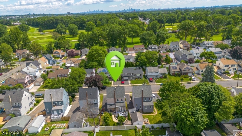 Renovated in 2018, this turnkey home offers contemporary updates across four finished levels of living space. You'll appreciate the open, airy feel created by the seamless flow between rooms, and the refinished hardwood floors that complement original woodwork. From here, the home reveals its heart: a kitchen that has been updated for everyday functionality. A center island with a butcher block top provides additional prep space. A rustic barn door adds a touch of farmhouse character at the basement entrance, and doors open directly to the deck, creating an indoor-outdoor connection for entertaining. A sun-drenched office flows effortlessly into a gracious formal dining room. A convenient half bathroom on this level rounds out the first floor. Upstairs, the second level offers three bedrooms, each outfitted with new light fixtures and blinds, sharing a full bathroom. Up one more flight you'll find a finished attic. The finished basement is an entertainer's dream, anchored by a striking stained-glass-style light fixture. A laundry room and full bathroom complete this level. Outside you'll enjoy a fully fenced backyard ft a lush Kentucky Bluegrass lawn maintained by an in-ground sprinkler system, a spacious patio, a raised deck, and beautiful landscaping. A shed and a motorized Sun Setter retractable awning add the finishing touches to this outdoor space. Ideally located less than a mile from local bus routes and Morris Avenue and less than two miles from Union train station.