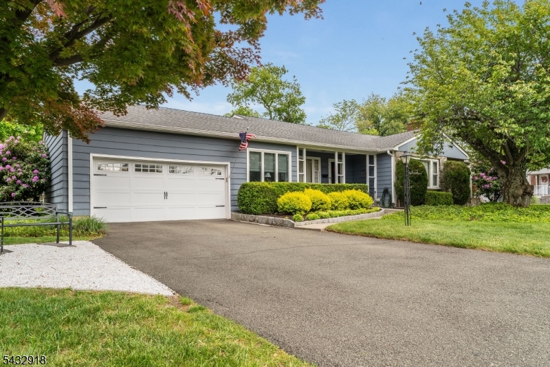 Welcome home to this charming, spacious, and meticulously maintained 3 bed/2.5 bath ranch, set on a beautiful corner lot with mature landscaping in one of South Plainfield's most desirable neighborhoods. After pulling into the double wide driveway, proceed up to a broad rocking-chair front porch. Entering through the foyer, find the home's formal dining room immediately to your left. Proceeding to your right, the large, bright living room is the focal point of the home. With a gas fireplace, built in bookshelves, and a large picture window, this room is perfect for relaxing and entertaining in all seasons. At the rear of the home, a comfortable eat-in kitchen with updated appliances looks out over the tranquil backyard. Exiting the kitchen, a screened in breezeway doubles as a three-season room, and connects the home to a two car garage and a Belgium-block patio shaded by an overhead awning and climbing vines. For enjoyment of the yard, there is a crushed stone area perfect for a firepit or outdoor dining. Back inside, three generously sized bedrooms are arranged around a bathroom that includes double vanities, a stall shower, and a soaking tub. Downstairs, the finished basement provides ample storage and is perfect for use as a rec room, home office, or fitness area. The downstairs full bath also offers potential for the use of the basement as an additional bedroom or guest suite. Easy access to 287, 22, 78, and NJ transit rail lines.