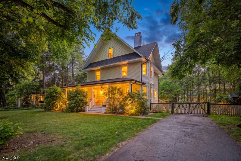 Experience one of Glen Rock's most charming neighborhoods on a rare, oversized 0.436 acre lot. Completely reimagined & extensively renovated, this exceptional residence blends timeless character with sophisticated modern living. A welcoming wraparound porch leads to beautifully appointed interiors featuring a gracious foyer, dining room, sitting room, spacious living room with wood-burning fireplace & a spectacular chef's kitchen. Designed for everyday living & entertaining, the kitchen showcases custom cabinetry, quartz countertops, premium appliances, abundant storage & a large center island with access to the rear deck. The second floor offers two spacious bedrooms & two renovated baths, including a luxurious primary suite with walk-in closet and spa-inspired bath. The third level features two additional bedrooms plus attic space with plumbing in place for a future bathroom. The finished lower level provides recreation space, a full bath & laundry area. Set on an impressive 0.436 acre lot with beautifully landscaped grounds, expansive lawn space, entertaining areas & a detached two-car garage. Enjoy Glen Rock's top-rated schools, vibrant downtown, parks & dual NJ Transit train lines with convenient access to Manhattan. A rare turnkey opportunity in one of Bergen County's most sought-after towns, with exceptional potential for future expansion.